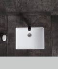 Top view of Lincoln Undermount Ceramic Basin Sink In Glossy White For Modern Bathrooms with sleek lines on dark countertop.
