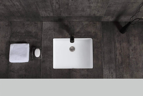 Top view of Lincoln Undermount Ceramic Basin Sink In Glossy White For Modern Bathrooms with sleek lines on dark countertop.