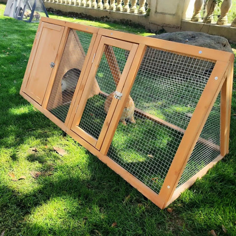 Outdoor Rabbit Hutch And Chicken Coop With Ventilated Wire Run And A Frame Design, wooden small animal cage on grass