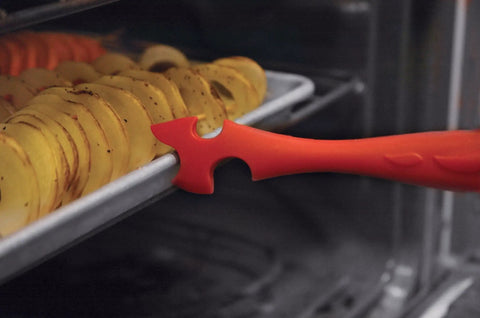 Silicone Oven Rack Push Pull Tool With Cool Touch Handle for safe rack and pan removal, red tool pulling tray of roasted potatoes