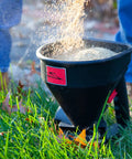 Five Pound All Season Handheld Spreader With Easy Fill Design for seed distribution in grassy area, rugged poly body, 5 lb capacity