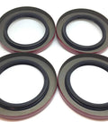 Pack Of Four Premium Trailer Hub Wheel Grease Seals With Double Lip Construction And Two Point Two Five Inch Inner Diameter on white background.