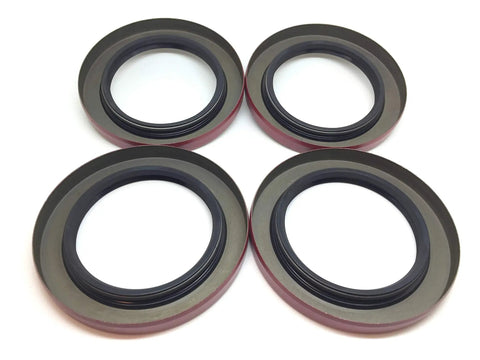 Pack Of Four Premium Trailer Hub Wheel Grease Seals With Double Lip Construction And Two Point Two Five Inch Inner Diameter on white background.