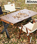 Outdoor table with Set Of 2 Industrial Country Style Steel Table Legs For 28 By 30 Inch Tables, surrounded by chairs on fallen leaves.