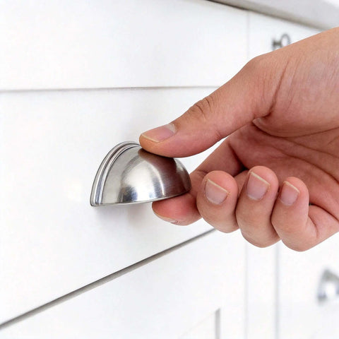 Person installing 10 Pack Cabinet Pulls With 3 Inch Center To Center Brushed Nickel Zinc Alloy Drawer Handles on a white cabinet