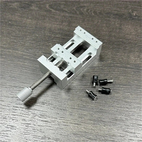 Super Cool Mini Drill Press Vise With Rubber Soft Jaws For Aluminum Alloy Woodworking Projects displayed on wooden surface.