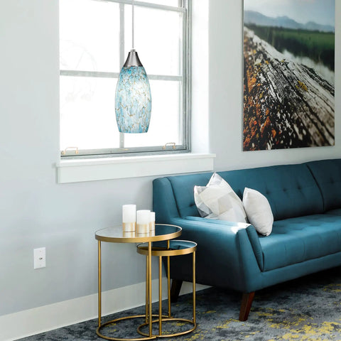Living room with Edishine Handcrafted Art Glass Pendant Light With Turquoise Blue Swirl Shade, Plug In Hanging Light over table.