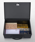 Open fire resistant safe box with key lock for home office security, sturdy steel safe showing passports, letters, and gold bars inside.