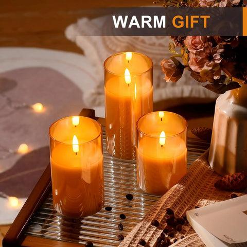 Glass Battery Operated LED Flameless Candles With Remote And Timer Pack Of 3 Real Wax Look Flickering Warm Light Gold on table