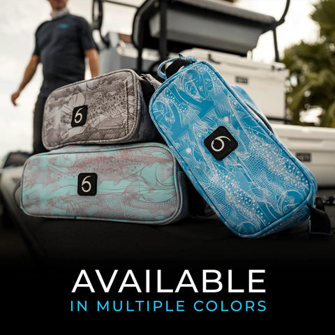 Beast Of A Tackle Bag For Fishing Gear And Soft Plastics, Extra Large, displayed in various colors on a dock.