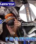 Close-up of a 9-inch oil filter wrench with adjustable levels, shown in use removing a filter under a vehicle.