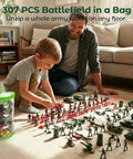 Child and adult playing with Epic 307 Piece Army Battle Toys Set with tanks, jets, flags, fences, and storage bag in living room.