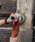 Heavy Duty Carbon Steel Wood Carving Wheel And Wood Shaping Disc For Angle Grinder in use on rough wood surface.