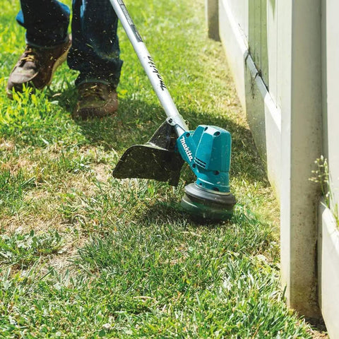 Person using 13-Inch Cordless String Trimmer With Brushless Motor, 18V LXT, No Gas Emissions, Low Noise Design, Variable Speed Trigger
