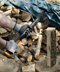 Person chopping wood wearing WG015 Level 5 Cut Resistant Construction Work Gloves With Foam Nitrile Coating and Microfoam Grip