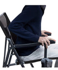 Person sitting on Ultra Easy Fold Up Outdoor Camping Chair For Adults With Mesh Back And Wide Seat Sturdy Powder Coated Steel Frame Portable