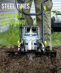 Close-up of 18 Inch Electric Tiller Cultivator with 8.7 Inch Depth and 24 Steel Tines in action, tilling garden soil.