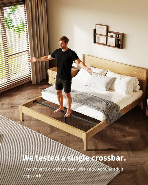 Heavy Duty Queen Bed Frame Sag Saver Center Support Cross Bars Steel Reinforcement Kit shown on wooden bed. Man stands on bed.