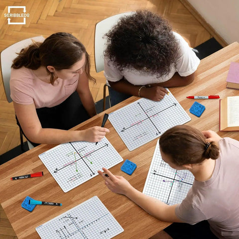 Students using Dry Erase XY Axis Graph Lap Boards Set 9x12 Inches Double Sided Whiteboards For Classrooms at a desk