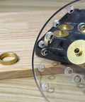 11-piece brass router template bushing guides set with 1/4" shank, close-up on bushings mounted to a clear sub-base