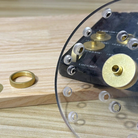 Close-up of 13 Piece Brass Router Template Bushing Guides Set with carrying case, showing brass bushings and acrylic plate detail.