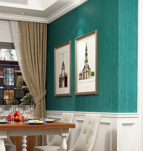 Dining room with teal green grasscloth peel and stick wallpaper roll 15.8x240 inches self adhesive on a feature wall.