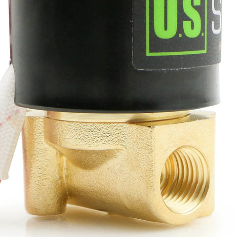 Close-up of brass 1/4-inch electric solenoid valve with black coil and threaded inlet port
