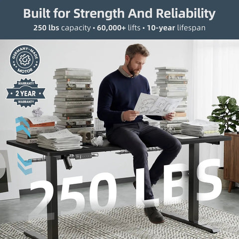 Man sitting on Electric Standing Desk That Moves Smoothly, 60 By 30 Inches, with papers, showcasing 250 lbs strength