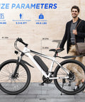 Man standing with Powerful 1000W Peak Electric Mountain Bike For Adults With 26-Inch Wheels next to size parameters chart