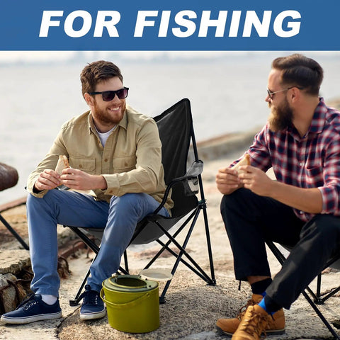 Two men sitting on Two Pack Ultra Lightweight Camping Chairs with Carry Bag, ideal for fishing by the shore.