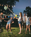 Outdoor string light poles 2 pack 10 ft tall ground insertion for backyard parties and weddings, people enjoying festive decor