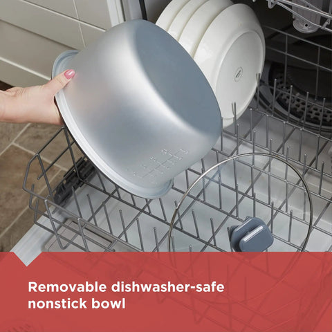 Hand placing removable nonstick bowl from Rice Cooker With 6 Cup Cooked Capacity, No Fuss Steaming Basket into dishwasher.