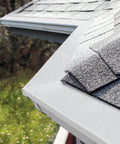 Heavy Duty Stainless Steel Gutter Guard 48 Ft Universal Fit For 4 And 5 Inch Gutters Micro Mesh Leaves Screen White installed on roof corner