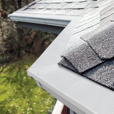 Heavy Duty Stainless Steel Gutter Guard 48 Ft Universal Fit For 4 And 5 Inch Gutters Micro Mesh Leaves Screen White installed on roof corner