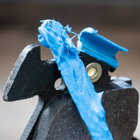 Ceramic Brake Lubricant For Extreme Heat High Temp Performance applied on brake pad to prevent seizing and squeaks