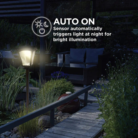 Sun Powered Outdoor Solar Lamp Post Light 65 Inch Tall Black Garden Decor With Warm LED lighting up a yard path at night