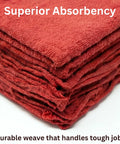 Close-up of folded red cotton shop towels showcasing texture and absorbency, part of 12 pack for garage and auto care.