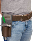 Man wearing 2 Inch Wide Full Grain Leather Tool Belt For Pros 100 Percent Cowhide With Double Tongue Steel Roller Buckle Heavy Duty Belt