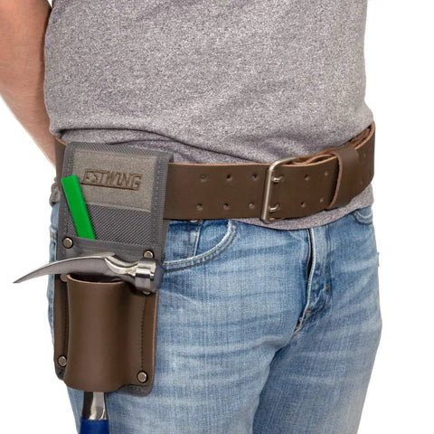 Man wearing 2 Inch Wide Full Grain Leather Tool Belt For Pros 100 Percent Cowhide With Double Tongue Steel Roller Buckle Heavy Duty Belt