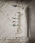 Statement Three Function Showerhead With Katalyst Air Induction in polished chrome, mounted on marble wall in modern bathroom.