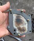 Nkiy Quen non-asbestos gasket sheet, gray outer layer with metal-reinforced center, 15 x 11.8 in, bolt holes visible.