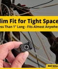 Person holding a black Slim 0.6 Inch Cable Tie Mount with screws against background of tangled wires.