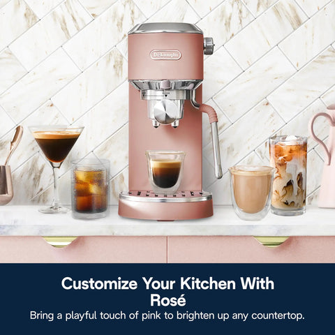 Compact Espresso Machine And Cold Brew Coffee Maker With Automatic Milk Frother Wand For Next Level Hot Iced Coffee Crafts And Dope Daily Sips In Sleek Rose Pink on kitchen counter with drinks.
