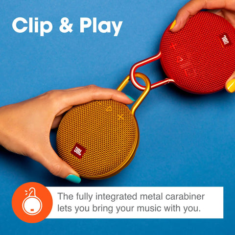 Two hands holding Clip 3 Fiesta Red Portable Bluetooth Speaker With Up To 10 Hours Of Playtime, Waterproof And Durable, Built In Carabiner Clip