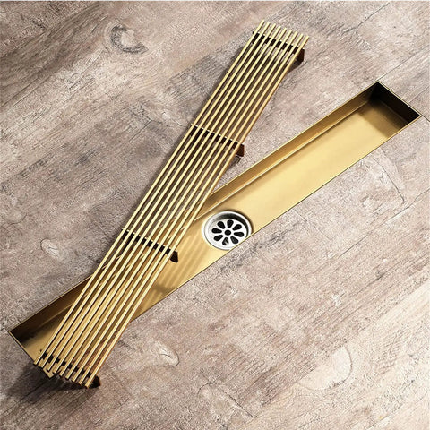 Stainless Steel Rectangle Floor Drain Insert With Pop Off Grate And Hair Catcher Stops Hair Snafus Quick Flow Action And Pull Out Tray on wood floor.