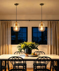 Pendant Lights Kitchen Island, Hand-Blown Clear Glass Brass Gold 9 Inch H, illuminating a stylish dining area with warm light.