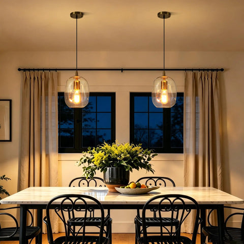 Pendant Lights Kitchen Island, Hand-Blown Clear Glass Brass Gold 9 Inch H, illuminating a stylish dining area with warm light.