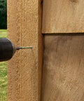 Using a drill with No Sweat Finish Trim Screws #7 X 2 In Tan Exterior Coating for deck installation on wood.