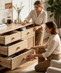 Kickstart Your Remodel With Solid Vintage Unlacquered Brass Dome Cabinet Knobs on wooden drawers used by two women.