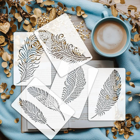 Awesome Boho Feather And Mandala Stencil Set, Six Durable PET templates on a book with a cup of coffee.